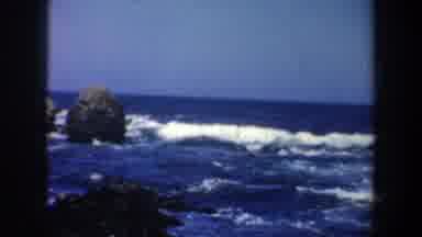 San Francisco California (1957): Woman Wearing Blue Shorts Walks On Black Rocks On