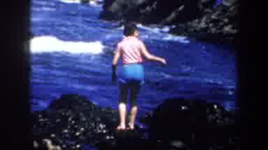 San Francisco California (1957): A Woman Climbs A Rock Close To The Shores Of An