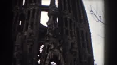 BARCELONA SPAIN-1959: Camera Pans Downward Showing Old Tall Stone Building