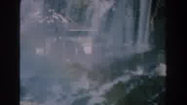 Michigan-1959: Young Boy Playing in Backyard with Man Walking Past