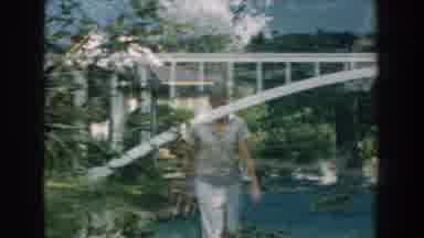 Michigan-1959: Double Exposed Shot Of A Bridge With Suburban People Walking