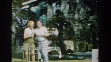 Michigan (1959): A Man And His Wife Dances Heartily Together With Others Watching