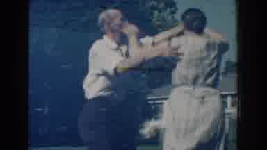 Michigan (1959): An Old Man And His Wife Dance Heartily Together In The Compound