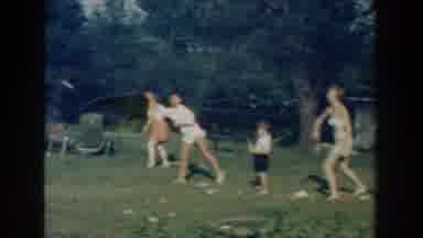 Michigan (1959): Men And Women Playing Recreational Sports On The Field