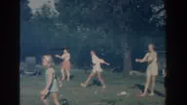 Michigan (1959): Men And Women Playing A Game Of Catch Outside On The Lawn While