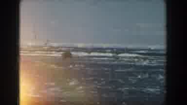 Michigan (1959): View Of Rainbow Ending Over Blue Ocean Waves On A Sunny Day