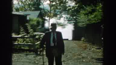 Michigan (1959): Old Man Walking Outside With Cane And Dressed Up
