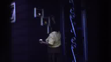 Michigan (1959): A Woman Reaching For An Object Up On The Cupboard