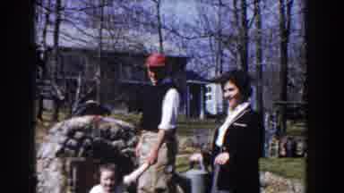 Michigan (1959): Man Wearing Red Hat Holds Hand Of Girl Wearing White Shirt
