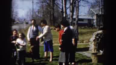 Michigan (1959): Family Playing In The Yard Outside Along With Pet Dog