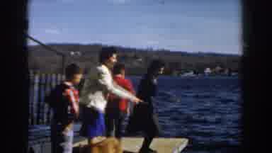 Michigan (1959): People Pointing Something In The Water And Simulating A Dive