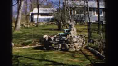 Michigan (1959): View Of Grey Stone Water Fountain On A Sunny Day