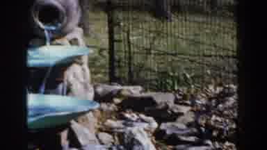 Michigan (1959): View Of Blue And Tan Outdoor Water Fountain On A Sunny Day