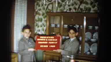 Michigan (1959): Two Ladies Show Off An Award As They Pose For A Camera Shot