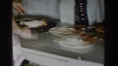 Michigan (1959): Father Prepares The Food While Aunts Watch Him