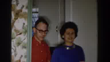 Michigan (1959): A Man In An Orange Shirt Works Together With His Wife