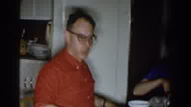 Michigan (1959): A Man And His Wife Preparing Dinner At Home With The Kids