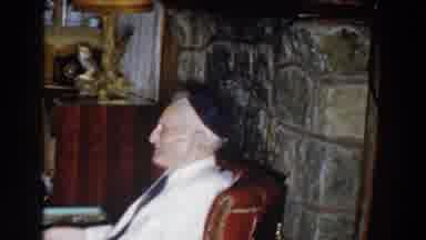Michigan (1959): An Elderly Man Relaxes On A Chair Listing In The Room