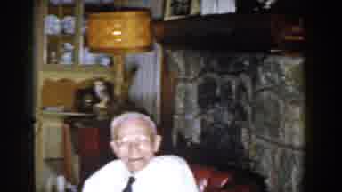 Michigan (1959): A Happy Gentleman In His House And Gets Up From The Red Armchair