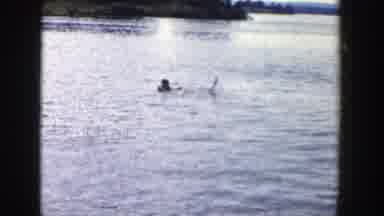 Wisconsin (1958): Cute Child In An Orange Life Jacket Playing In The Clean Sea