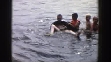 Wisconsin (1958): Swimming Man Kids Playing Water Tube Life Jacket Lake Sunny