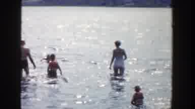 Wisconsin (1958): Men Women And Kids Are Swimming And Walking In Water