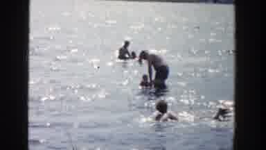 Wisconsin (1958): People Enjoy A Beautiful Sunny Day At The Sea Swimming In The