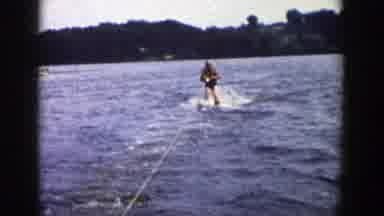 Wisconsin (1958): Man Water Skiing Behind A Boat Holding A Rope