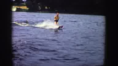 Wisconsin (1958): Man Having Fun While Using Water Skis At Beach Lake Outdoors