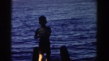 Wisconsin (1958): A Boy Prepares To Fish With A String And Rod Besides The River
