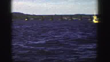 Wisconsin (1958): View Of Tan Barge On Blue Water On A Sunny Day