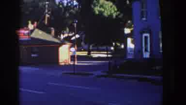 Wisconsin (1958): A Group Of Houses And A Lake In A Community