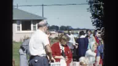 Wisconsin (1958): A Group Of Volunteers Share Food Items To People In The Area