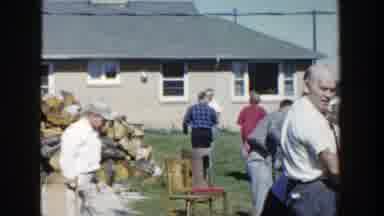 Wisconsin (1958): People Gathering In A Backyard Of A House