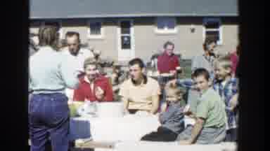 Wisconsin (1958): A Group Of People Together Outside Eating And Talking To One