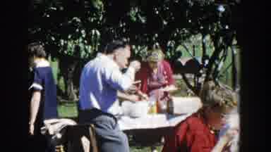 Wisconsin (1958): People Gathered Eating Outdoors And A Beautiful Day And They Are