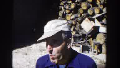 Wisconsin (1958): A Man Talking To Another At The Wood Joint By Midday