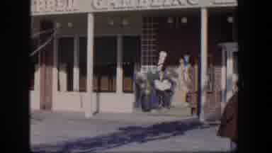 Las Vegas Nevada (1954): Person In Red Coat And Gray Hat Looking Backward At Ca