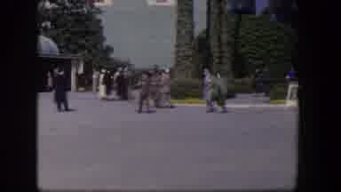 Las Vegas Nevada (1954): Group Of People Wearing Fancy Clothes Strolling Next To A
