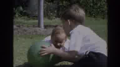 North Hollywood California (1964): A Boy Play With His Kid Brother Using A Ball On
