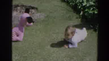 North Hollywood California (1964): A Baby Crawls On The Ground In A Military