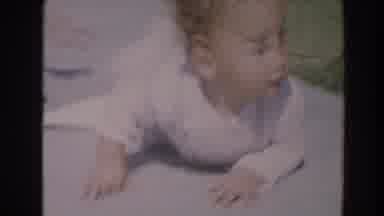 North Hollywood California (1964): Baby Crawling On The Blanket On The Ground To