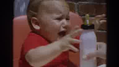 North Hollywood California (1964): When Given A Bottle Of Milk A Crying Baby In A