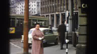 Pisa Italy (1959): A Woman On A Brown Jacket With Handbag Crossed The Busy Street