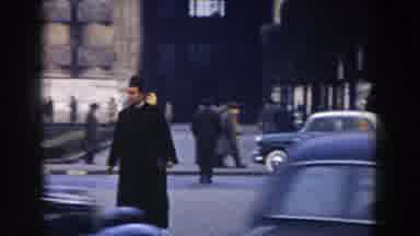 Pisa Italy (1959): A Man Walks In A Busy Street As Cars Move Around