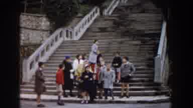 Pisa Italy (1959): Group Of People Standing On Tan Steps In A Clear Day