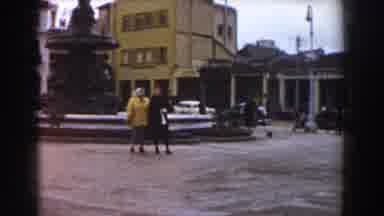 Pisa Italy (1959): Old Footage Of Two Old Romans In The Front Of A Water Fountain