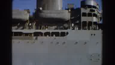 Pisa Italy (1959): Grey Ship Sails Past White Building On A Clear Sunny Day