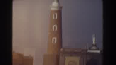 Pisa Italy (1959): A Large Building Then A Shot Of A Lighthouse And Mountains