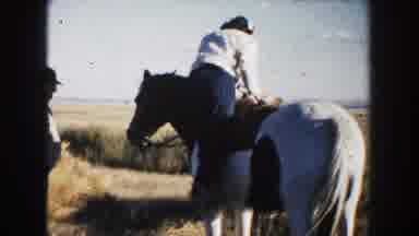 South Dakota (1953): Woman Climbs Onto Horse Close Up Of Her Face As She Talks To